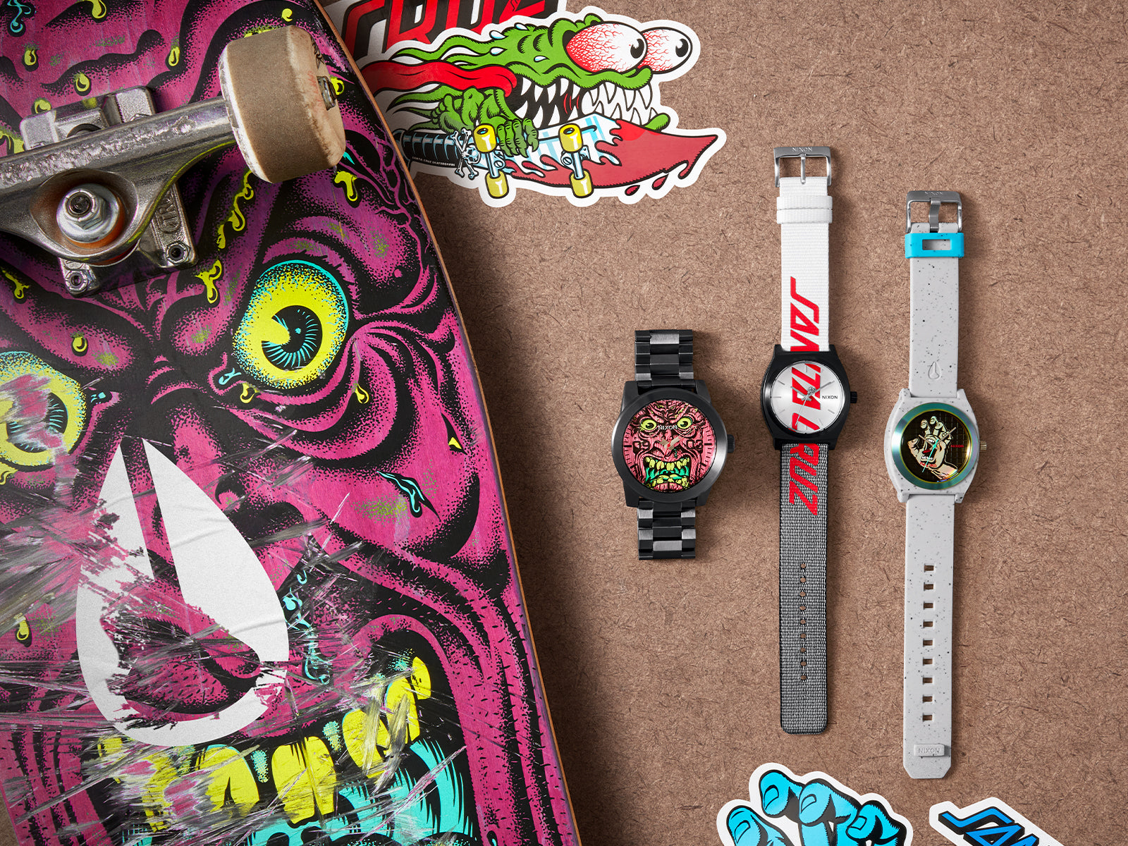 The Nixon x Santa Cruz watch collection next to a variety of Santa Cruz skateboard gear.